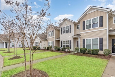 View of front of house with a front yard