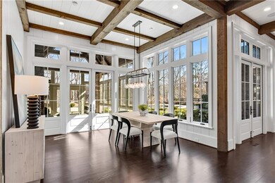 Sunroom / solarium featuring french doors, beamed 