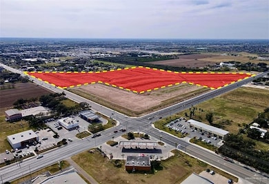 Aerial view of property and surrounding area featuring property boundaries highlighted
