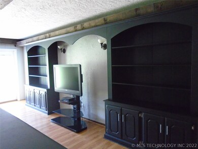 Built in shelves and storage in the den.