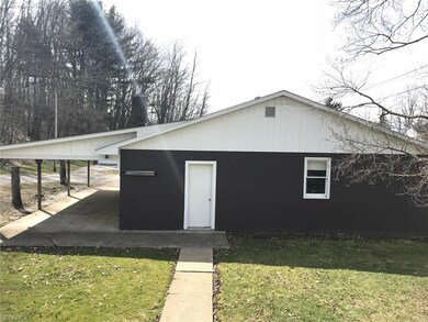 The awesome 3-car garage with carport is just a fe