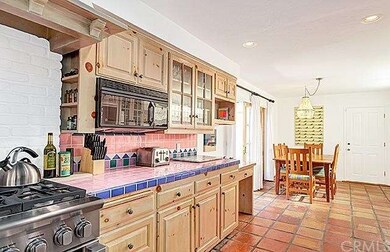 Charming Spanish tiles and new stainless appliance