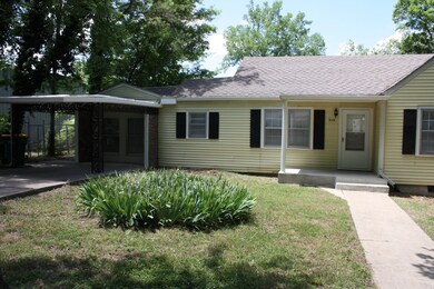 To left is concrete carport area(1 car)