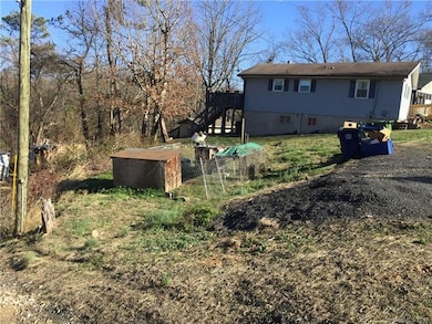 Another angle of lot from side, no value to old dog kennel