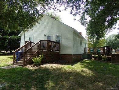 Rear view/deck with entry into laundry and kitchen