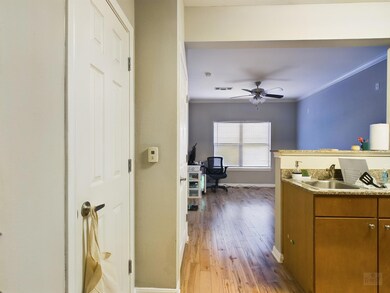 Kitchen with a sink, brown cabinets, baseboards, 