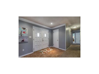 Entry with beautiful double doors.