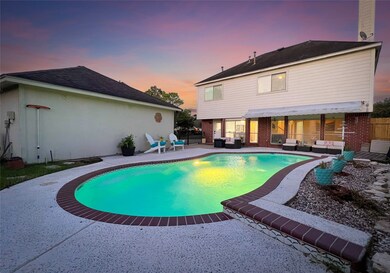 Inviting backyard oasis with sparkling pool.