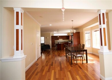 Grand foyer opens into a bright and...