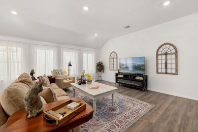 Family room has tall ceilings and plenty of room for large furniture.
