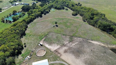 Aerial view of property's location featuring a large body of water