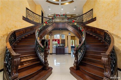 Stairway featuring a towering ceiling and tile patterned flooring