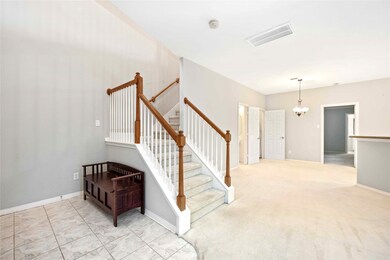 The Two Story Tiled Foyer with room for a bench is