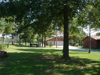 Carport, Garage/Shop and east side of home