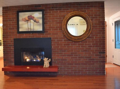 Warm and cozy brick fireplace with...