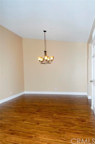 very cozy dining area with new light fixture.