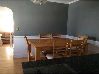 Dining Room. Arched doorway to LR.
