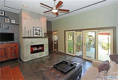 View of the sunken family room with custom firepla