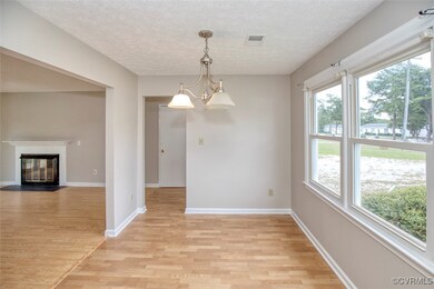 Unfurnished dining area with a chandelier, light h