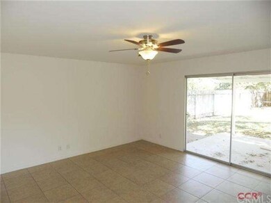 Living room with tile flooring, new paint & ceilin