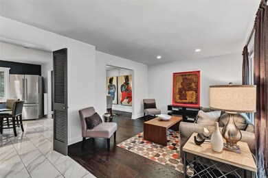 Living Room with new wood floors and porcelain tile.