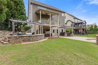 Stunning backyard with outdoor kitchen & hot tub.