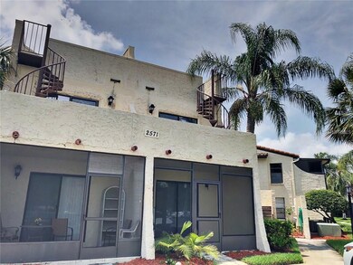 Front of the condo building, #103 front patio is t