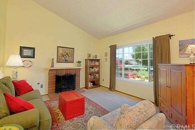 Living room.  Beautiful picture windows.  High cei