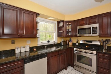 Large eat-in Kitchen with cherry cabinets, granite