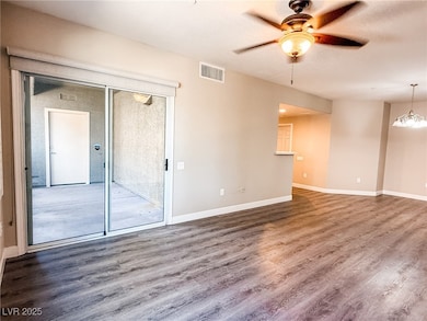 LVP floors throughout the house and ceiling fan, and a chandelier