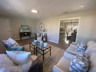 Living Room w/ View of Dining Area w/ Sliders to P