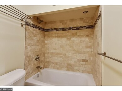 Updated bath with travertine tile