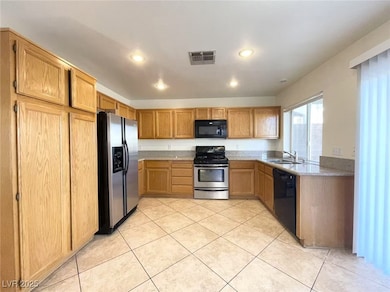 Kitchen featuring light tile patterned flooring, v