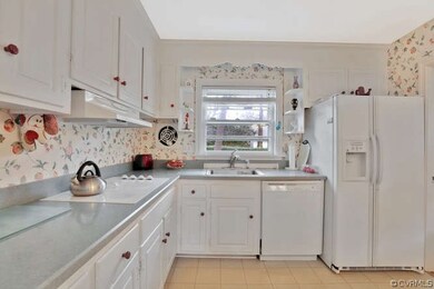 Partial Kitchen view, double-door refrigerator included.