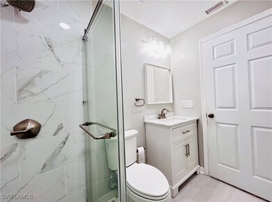 Guest Full bath with toilet, a shower stall, visib