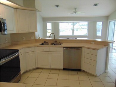Kitchen overlooking the Family Room and Breakfast 