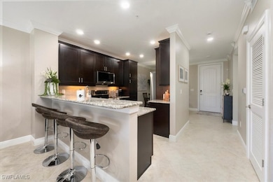 15114 Palmer Lake Cir unit 104, Naples, FL 34109 - photo 3