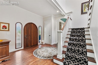 Foyer with hardwood floors