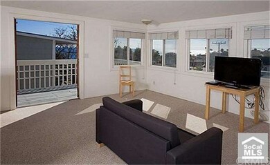 Ocean view living room and deck for 231 Beverly St