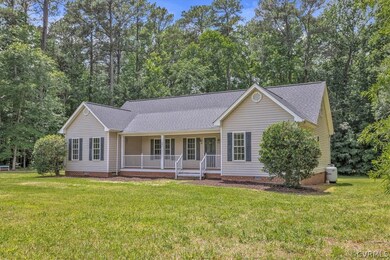 Single story home with a front yard and a porch