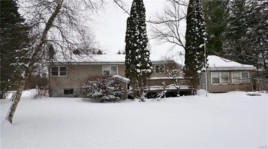 The enclosed porch on the right side needs work !!