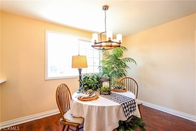 Light and bright dining room with designer chandelier