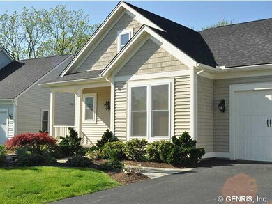 Exterior Front. Carriage-style garage doors finish