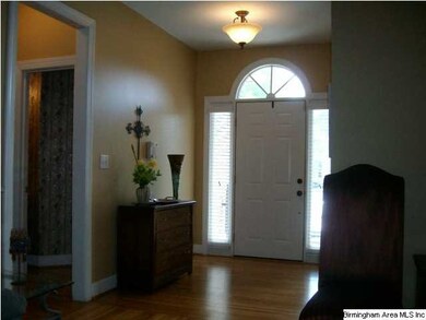 Inviting Foyer with hardwood flooring