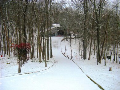 The long drive ensures your privacy and enhances the beauty of this property.
