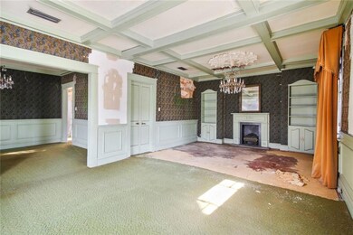 Large living room with fireplace, coffered ceiling