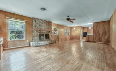 Unfurnished living room with light wood-style floo