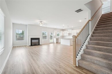 Unfurnished living room featuring a fireplace with