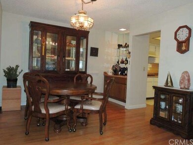 Cozy formal dining area with wet bar