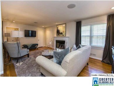Large Living/Dining area with Fireplace and Hardwo